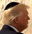 The president covered his head with a kippah, a skullcap worn by observant Jews.